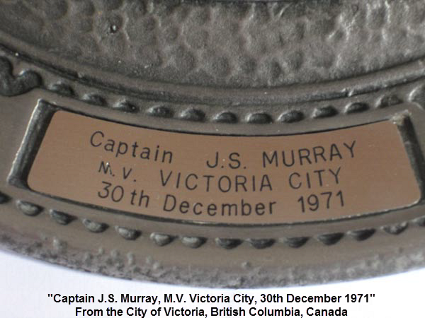 Close-up. Inscription on the pewter plate ... "Captain J.S. Murray, M.V. Victoria City, 30th December 1971" ... from the City of Victoria, British Columbia, Canada. Reardon Smith Ships